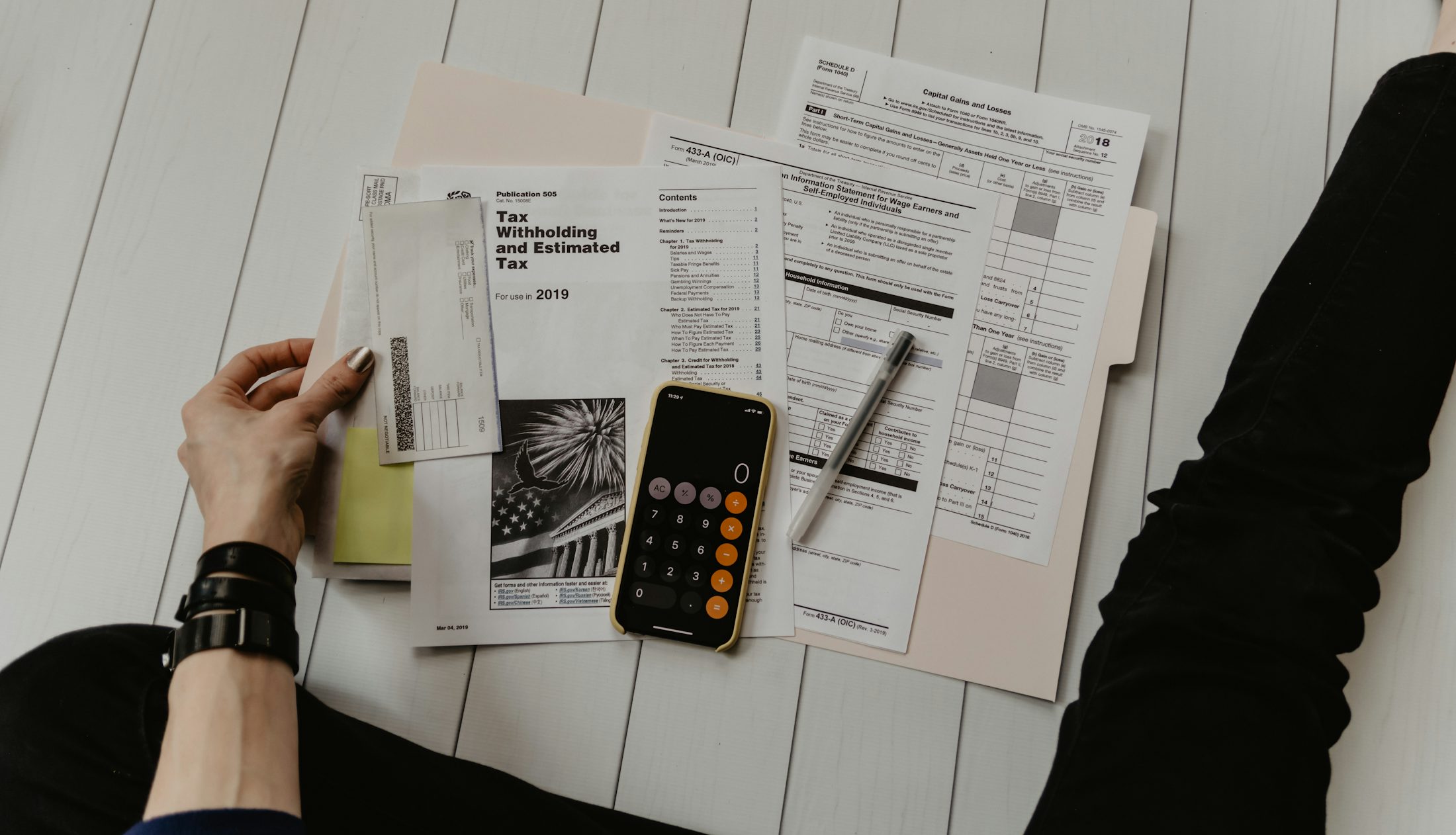 Financial paperwork and calculator supporting a case review